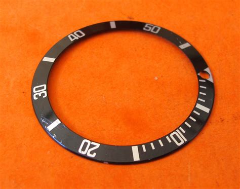 genuine rolex bezel insert.